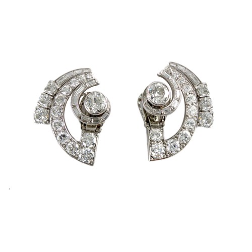 Art Deco diamond arc scroll cluster earrings by Rubel Freres, Paris, of stylised geometric leaf and bud design,